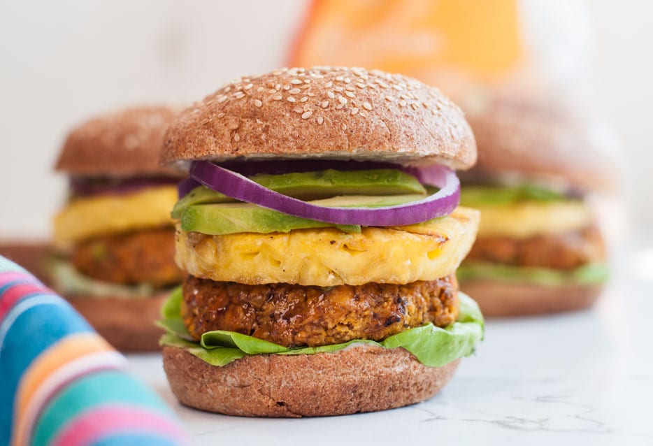 Polynesian veggie burger with pineapple, onions, lettuce, and avocado