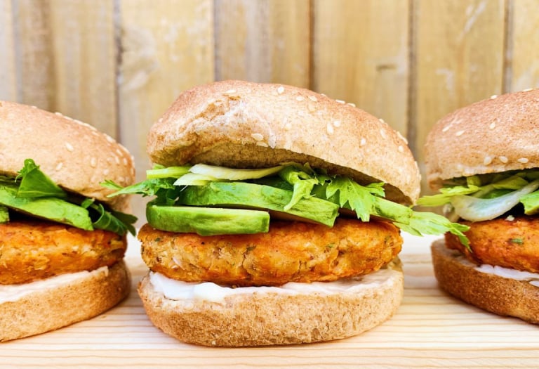 Desiree RD's Buffalo Cauliflower Burger on a Silver Hills Bakery sprouted whole grain burger bun topped with sesame seeds