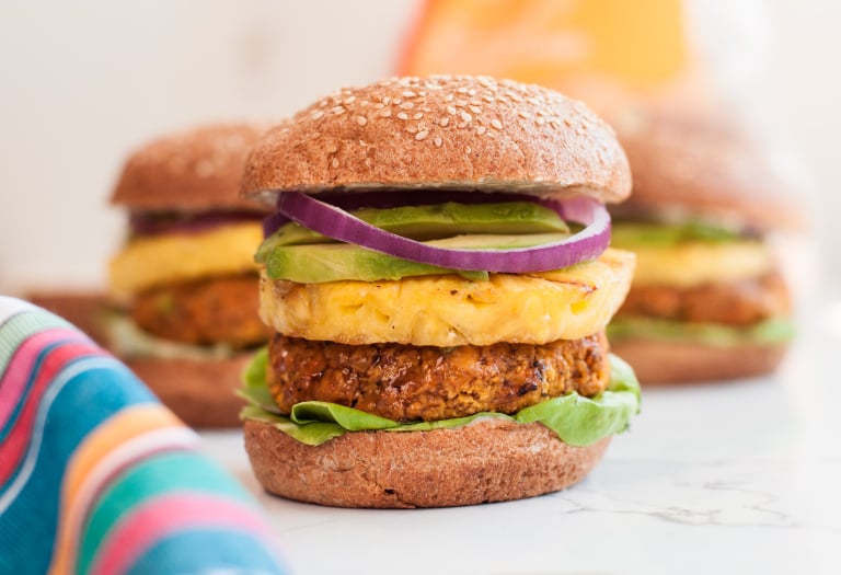 Pineapple-topped Polynesian Veggie Burger on a Silver Hills Bakery sesame seed sprouted whole grain burger bun