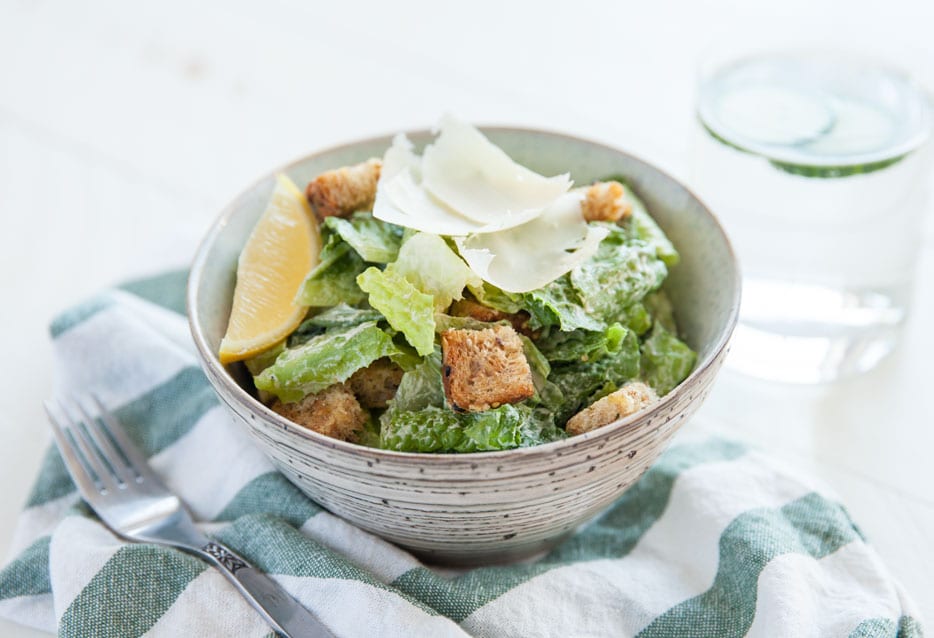Garlicky croutons made from sprouted whole grain bread are the secret to the perfect plant-based Caesar salad recipe