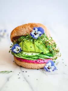 Summer Sandwich with Beet Hummus, Avocado, and Sprouts by Foody First